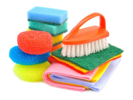 Office cleaner maintaining desks and meeting rooms in a Canary Wharf workplace