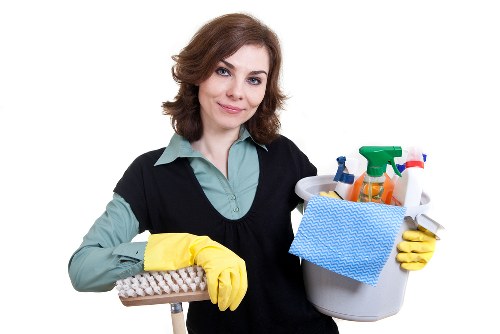 Supervisor checking cleaning equipment and workplace safety conditions