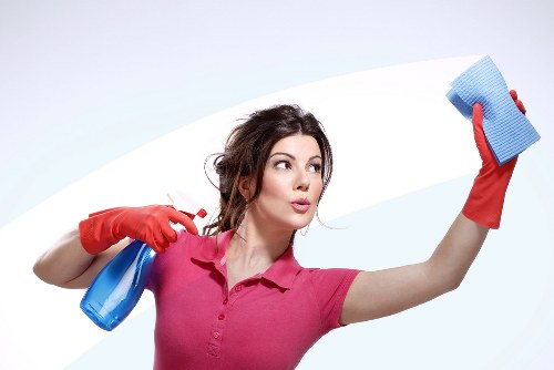 Cleaning a corner sofa in a Canary Wharf home